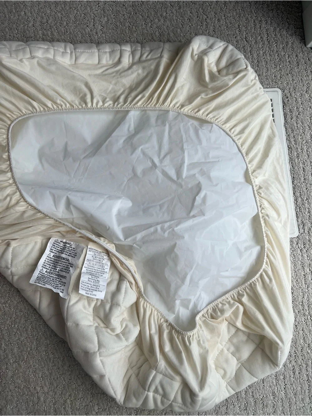 Baby crib quilted fitted mattress pad or protector in a soft ivory, 26”x39”